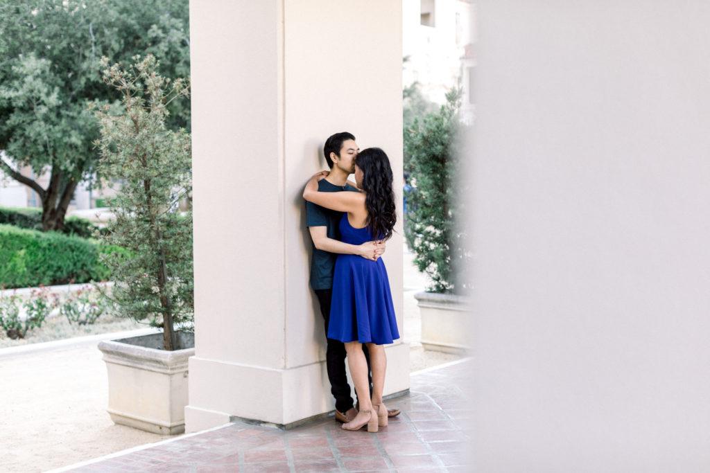 A couple kissing and hugging during their engagement session.
