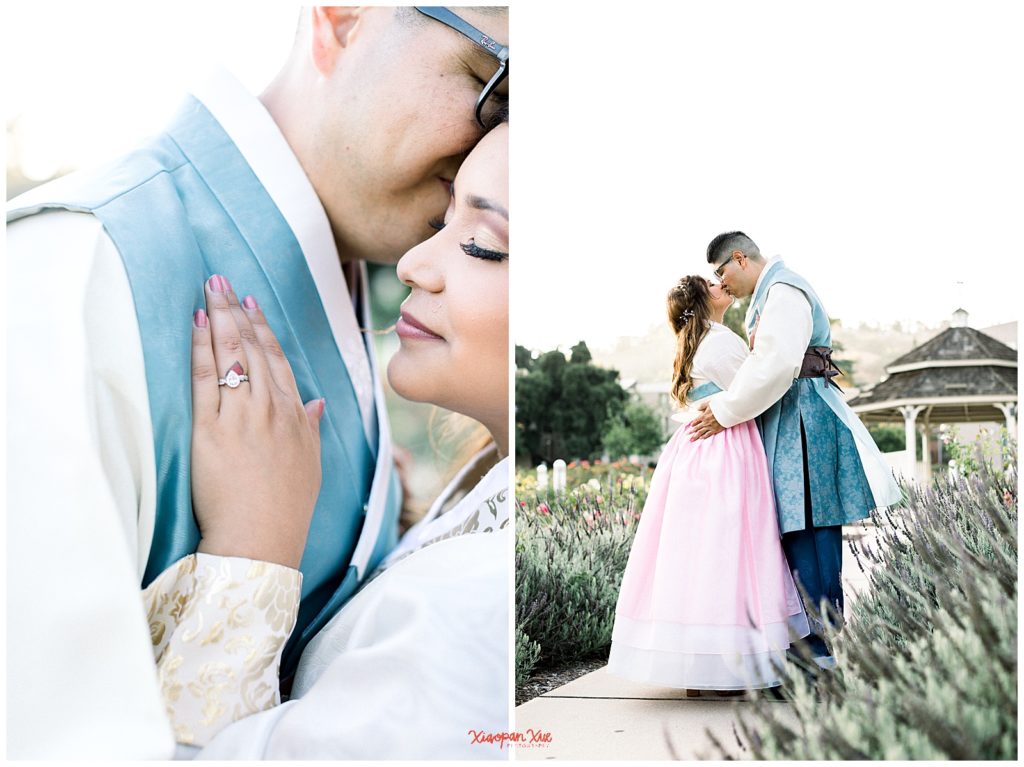 2 images side by side of an interracial couple embracing (Asian and Latina) in traditional Korean hanbok wear (pink and blue being the main colors); they are in a rose garden